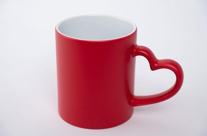 Red ceramic gift mug with a heart-shaped handle